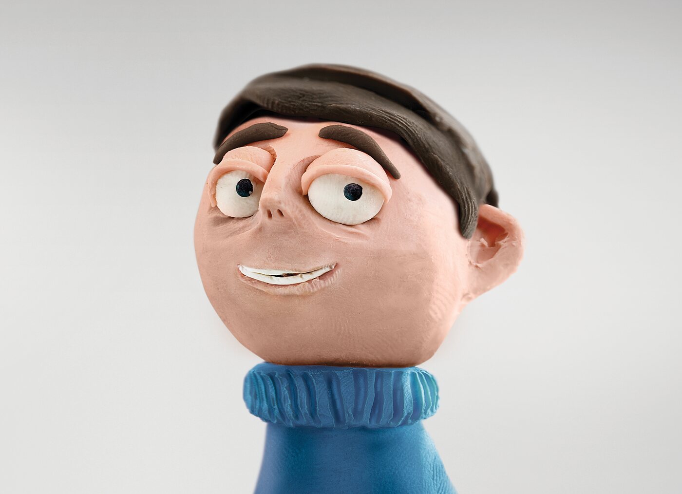 A handcrafted clay character from the Stepping Stones youth development campaign